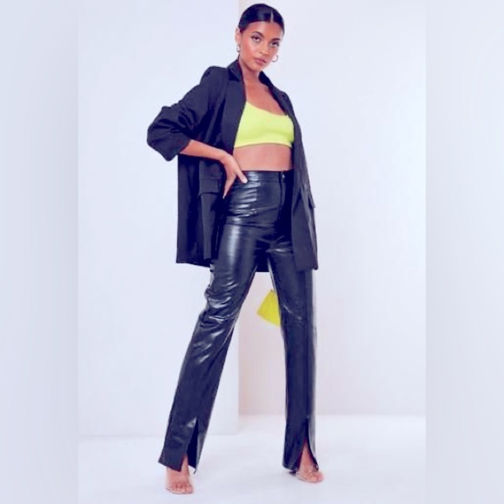 Black faux leather “ Misguided” trouser front split.